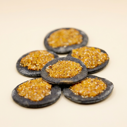 Stacked Kechek bites on cream background